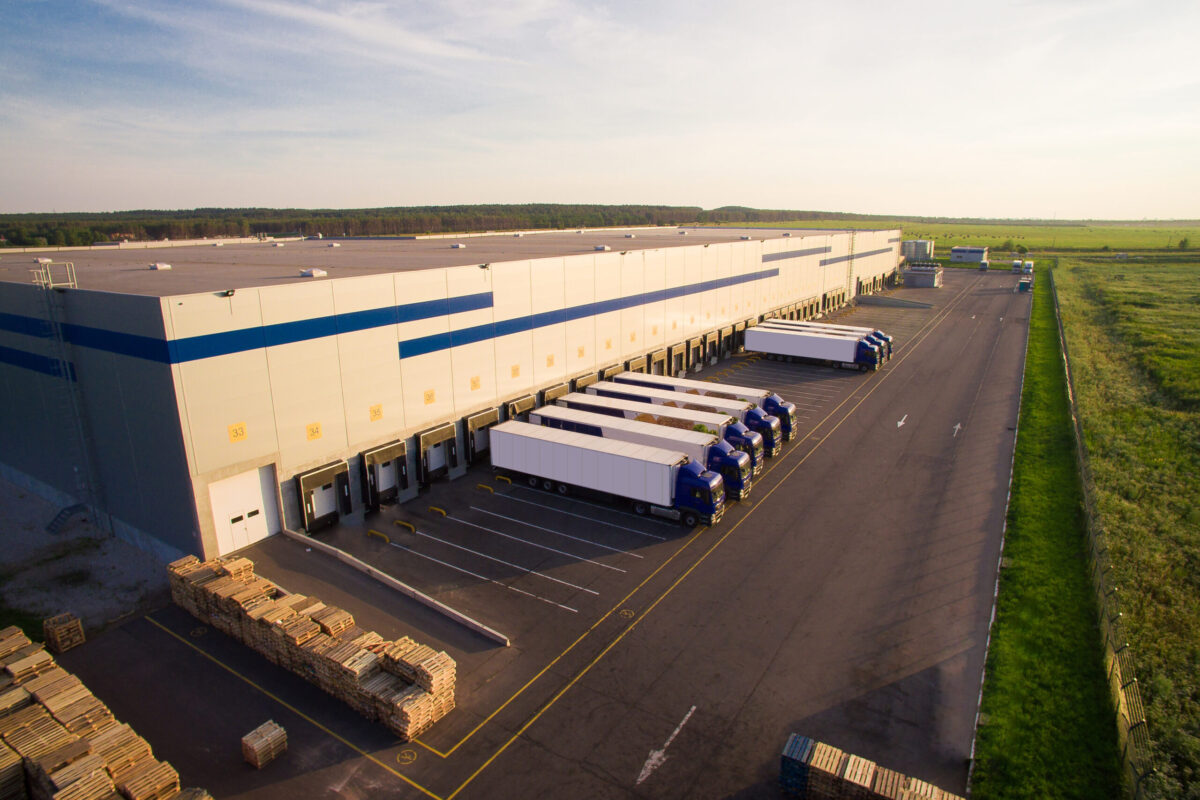 distribution warehouse with trucks of different capacity.